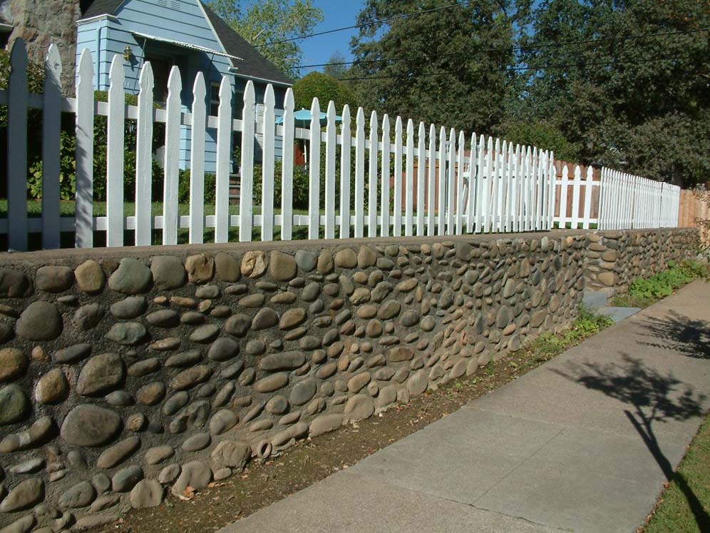 Concrete and Rock Wall with Fence